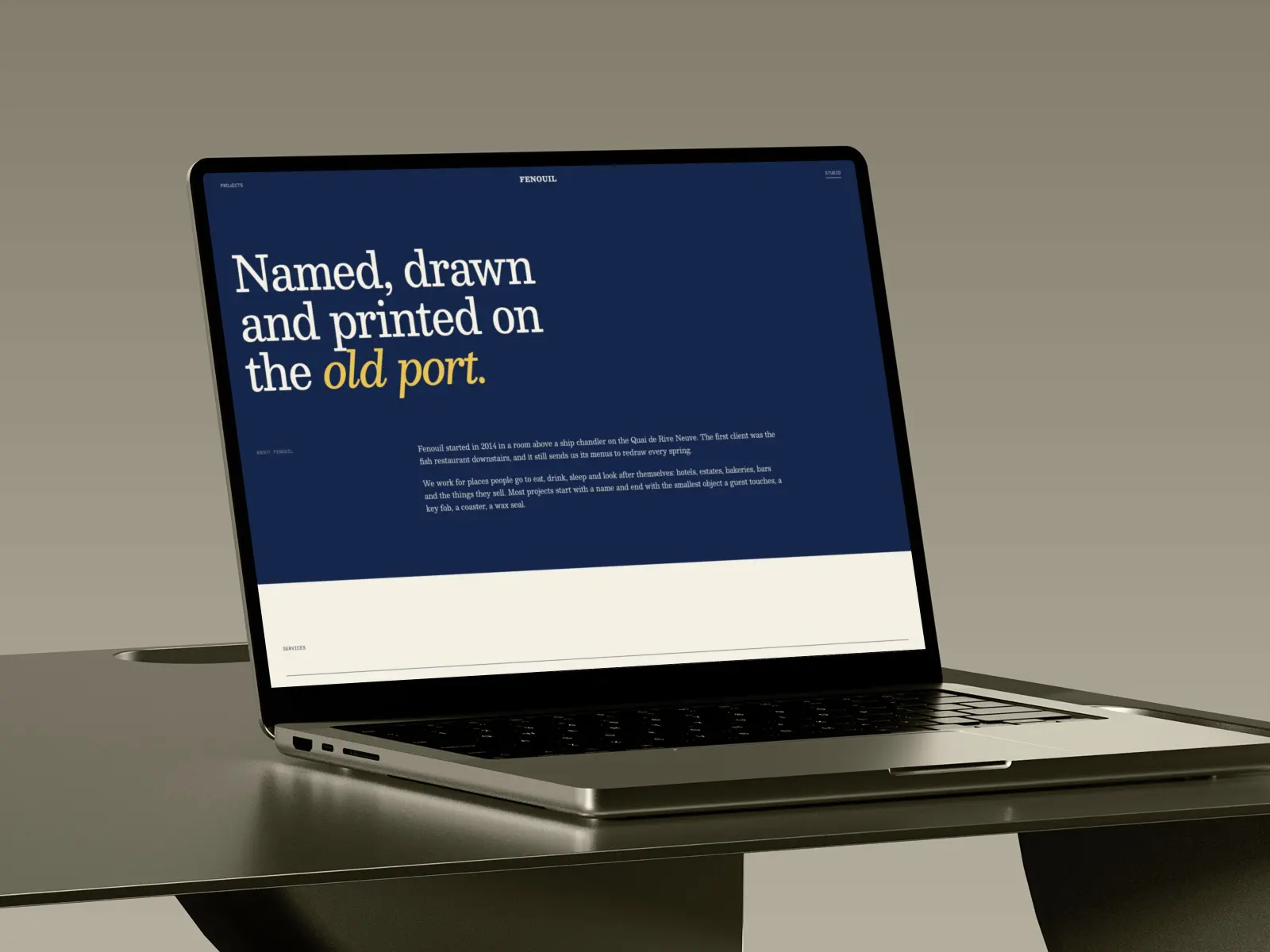 The Fenouil studio page, navy with a pastis headline, on a laptop